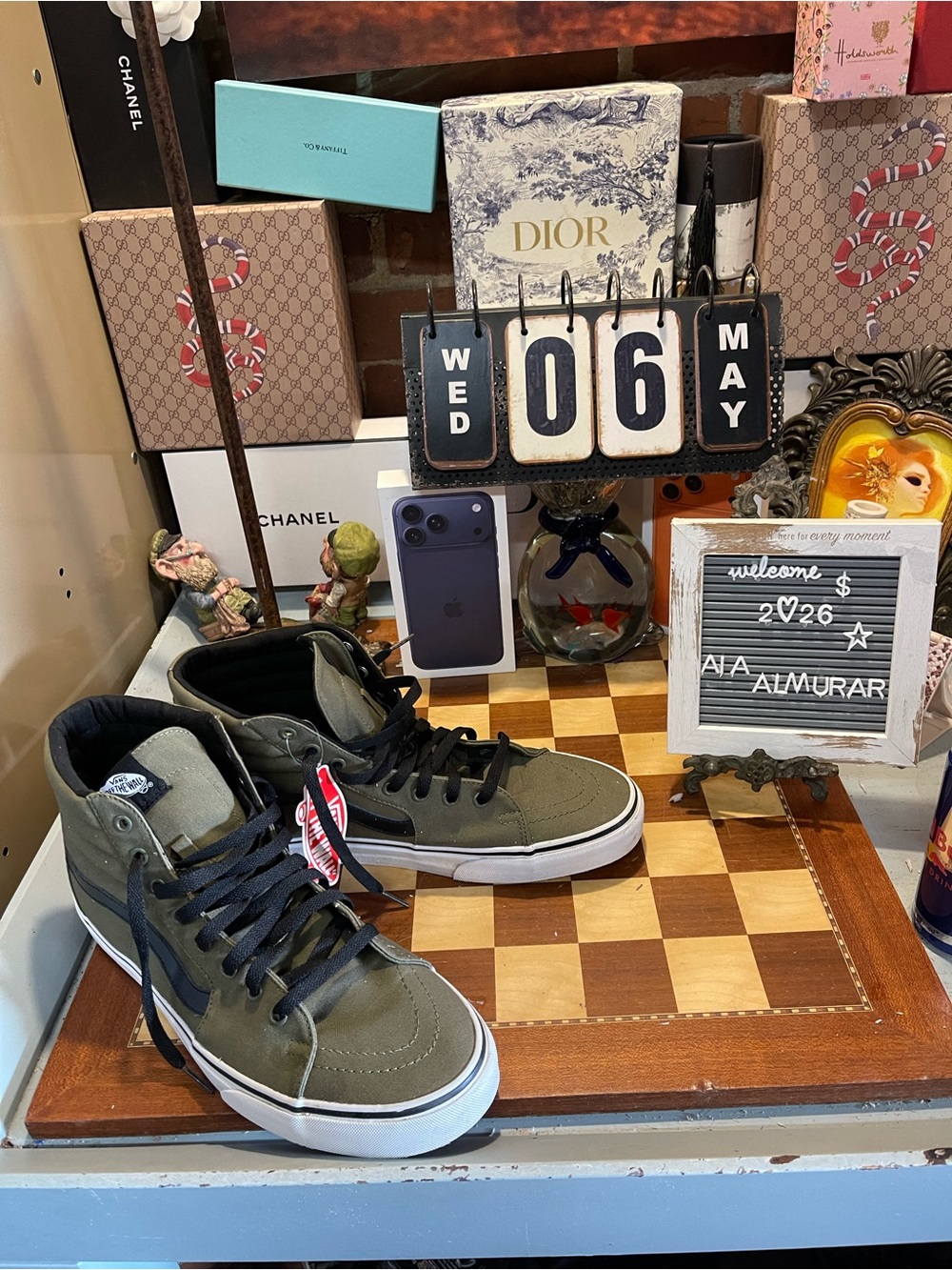 olive green Vans Sk8-Hi skate sneakers with black detailing and white midsoles